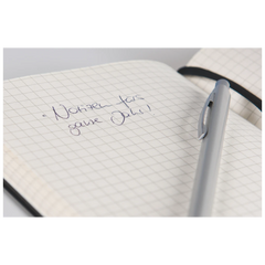 Notizbuch Kompagnon Klassik | A5, kariert, Gummizugverschluss, schwarz